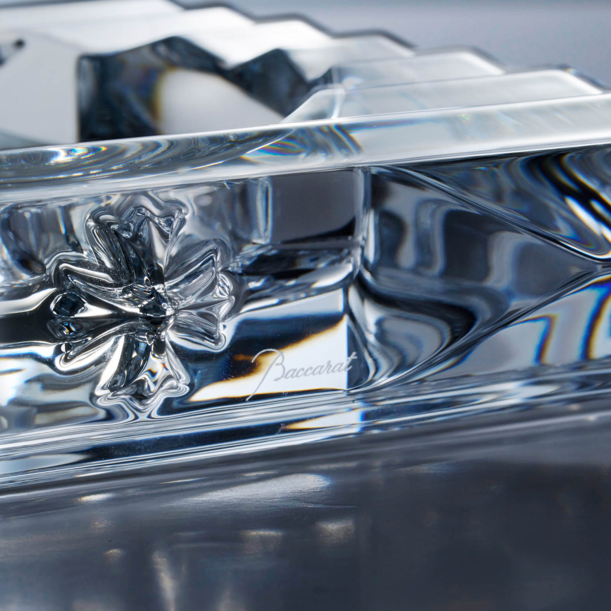 Close-up of Chrome Hearts cross motif on crystal ashtray base